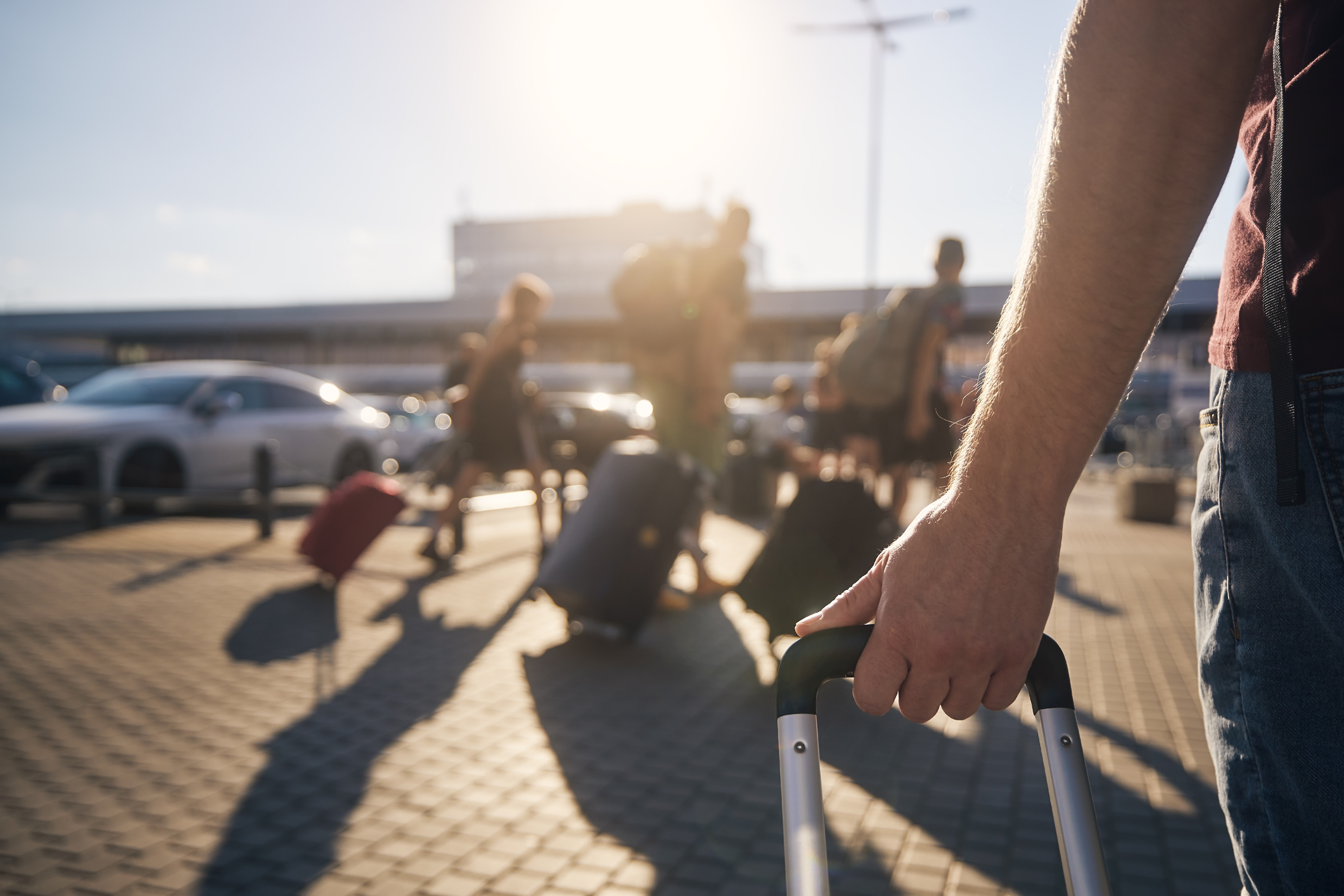 Group of people walking to airport terminal